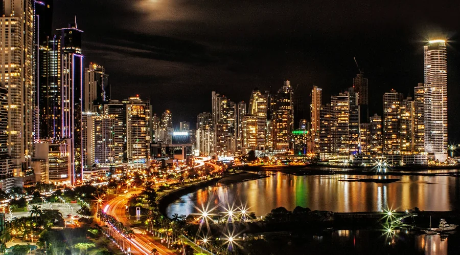 Waterfront skyline at night, chosen by Sotheby's International Realty for its move into Panama